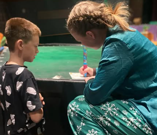 Young actors performing in a children's theatre production at RBV Drama